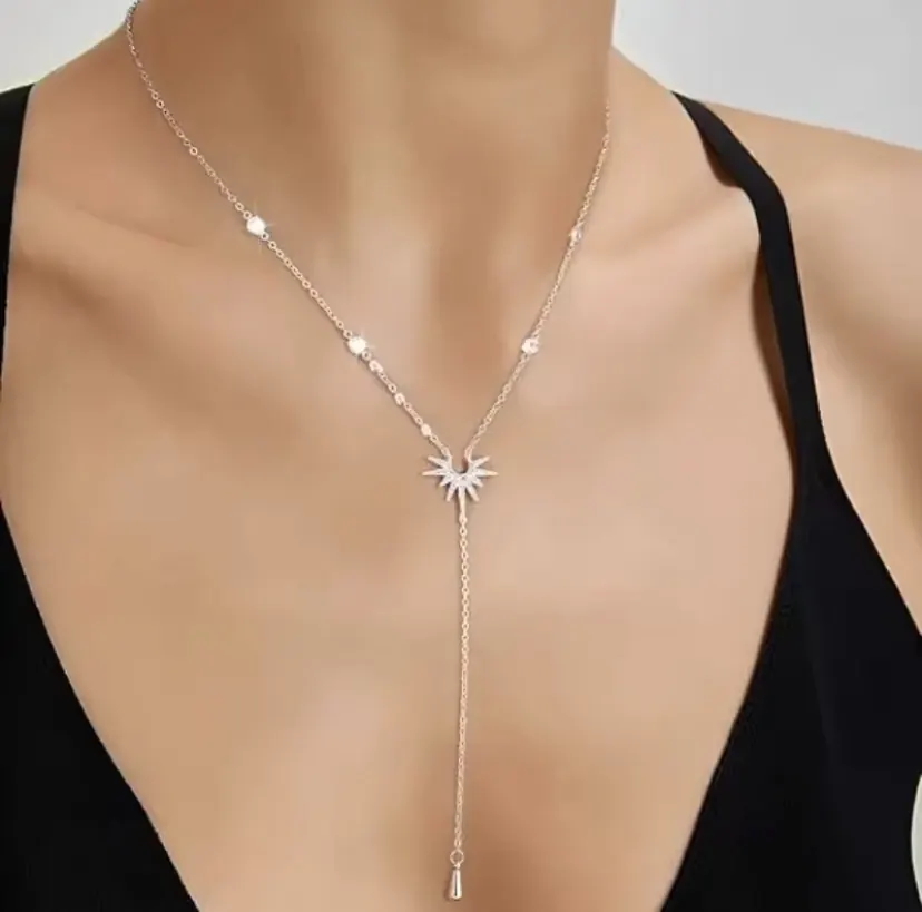 Veloura Sun Y-Necklace in silver worn with a black top