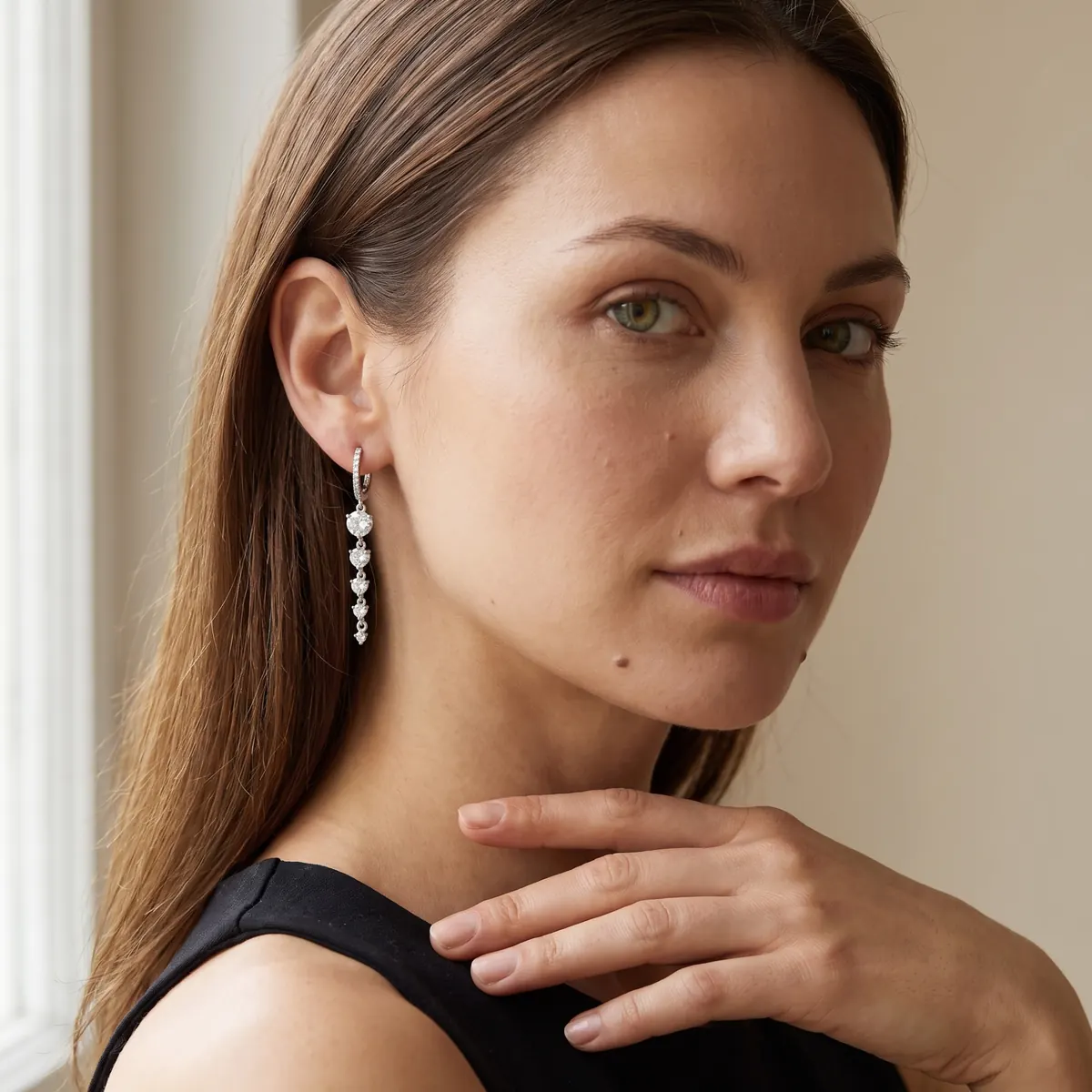 Close-up detail of Veloura Starry Night sterling silver hoop earrings